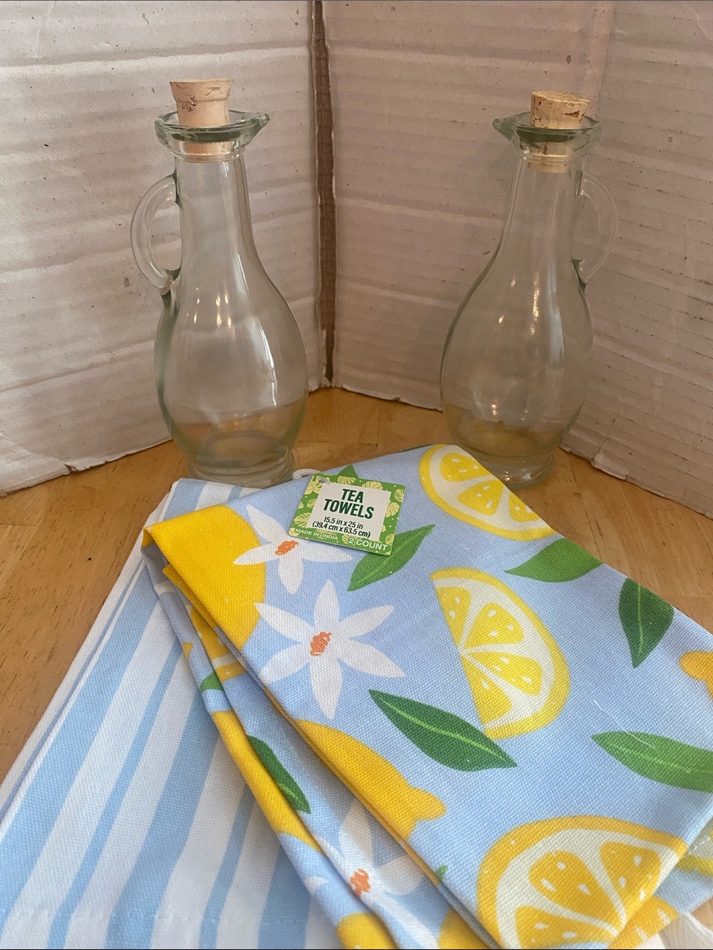 Oil & vinegar cruets abt 8 oz ea  plus 2 NWT Lemon & blue Print Tea Towels